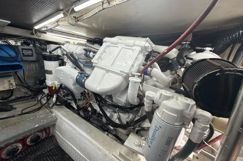 Slide: The Image of Engine room of a 1992 Ocean Yachts 48 Super Sport, showcasing detailed machinery. - 29