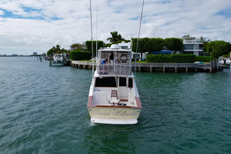 Slide: The Image of 1992 Ocean Yachts 48 Super Sport on water near waterfront homes. - 3