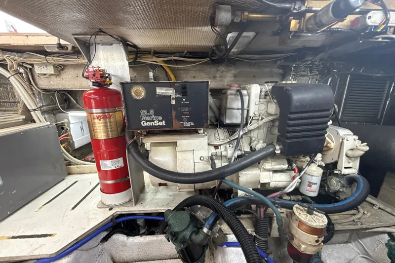 Slide: The Image of Engine room of 1992 Ocean Yachts 48 Super Sport with marine generator and fire extinguisher. - 37