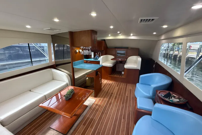 Slide: The Image of Luxurious interior of a 1992 Ocean Yachts 48 Super Sport with elegant seating and wood finishes. - 10