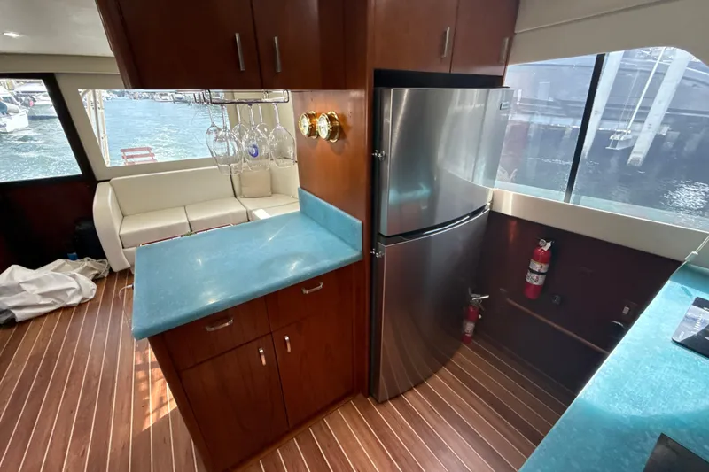 Slide: The Image of Luxurious 1992 Ocean Yachts 48 Super Sport interior with modern kitchen and waterfront view. - 15