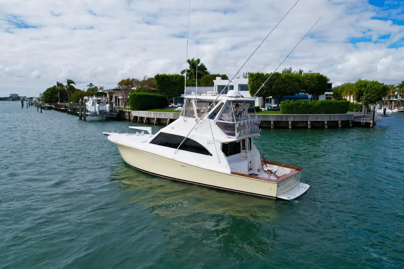 Slide: The Image of 1992 Ocean Yachts 48 Super Sport cruising on a scenic waterway. - 2