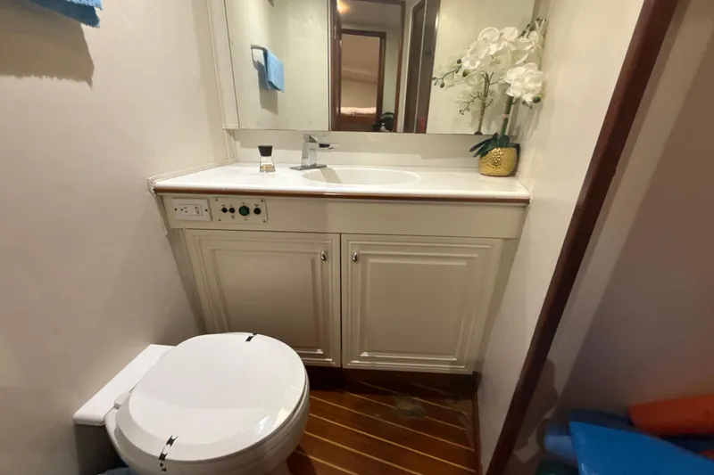 Slide: The Image of Bathroom interior of 1992 Ocean Yachts 48 Super Sport with sink, mirror, and toilet. - 20
