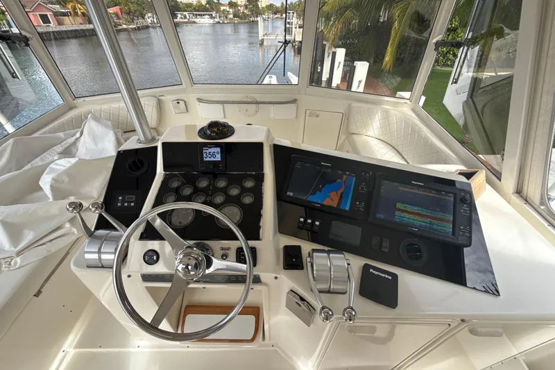 Slide: The Image of Helm of 1992 Ocean Yachts 48 Super Sport with navigation equipment and steering wheel. - 22