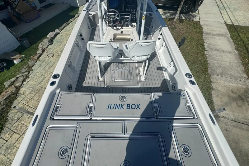 Slide: The Image of 2018 Blue Wave 2400 PureBay boat interior with "Junk Box" storage compartment. - 10