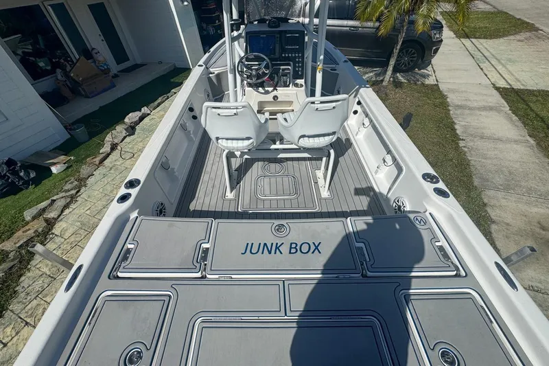Slide: The Image of 2018 Blue Wave 2400 PureBay boat interior with "Junk Box" storage compartment. - 11
