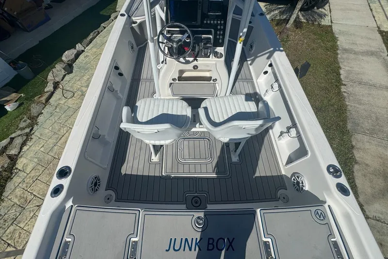 Slide: The Image of 2018 Blue Wave 2400 PureBay boat interior with dual seats and steering console. - 13