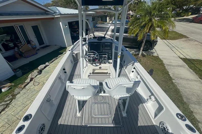 Slide: The Image of 2018 Blue Wave 2400 PureBay boat with dual seats and steering console. - 14