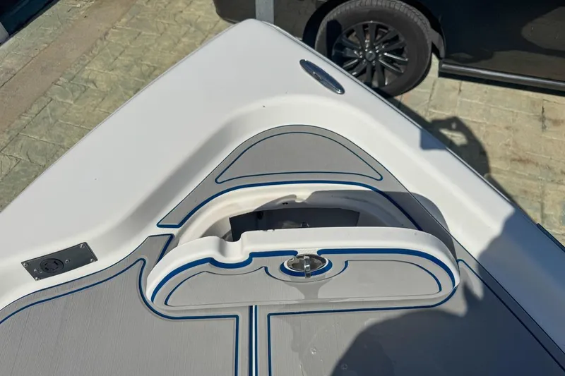 Slide: The Image of 2018 Blue Wave 2400 PureBay boat deck with storage compartment and sleek design. - 29