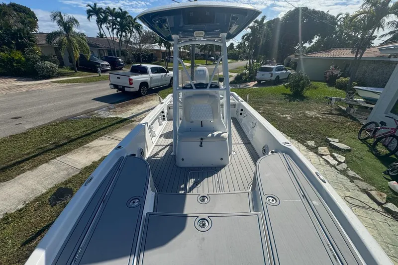 Slide: The Image of 2018 Blue Wave 2400 PureBay boat parked in a residential driveway. - 33
