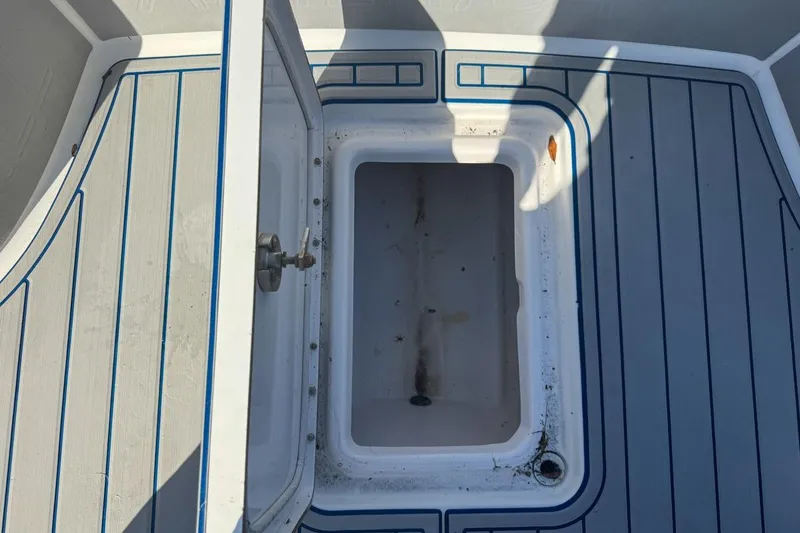 Slide: The Image of Open storage compartment on 2018 Blue Wave 2400 PureBay boat deck. - 39