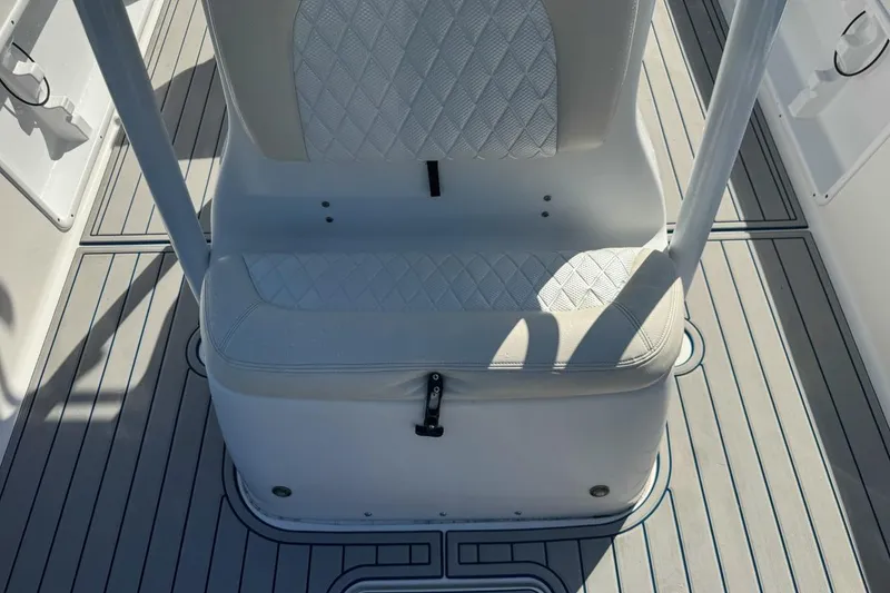 Slide: The Image of 2018 Blue Wave 2400 PureBay boat seat with diamond-pattern upholstery and sleek flooring. - 40