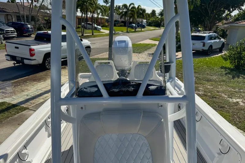 Slide: The Image of 2018 Blue Wave 2400 PureBay boat parked in a residential area. - 42