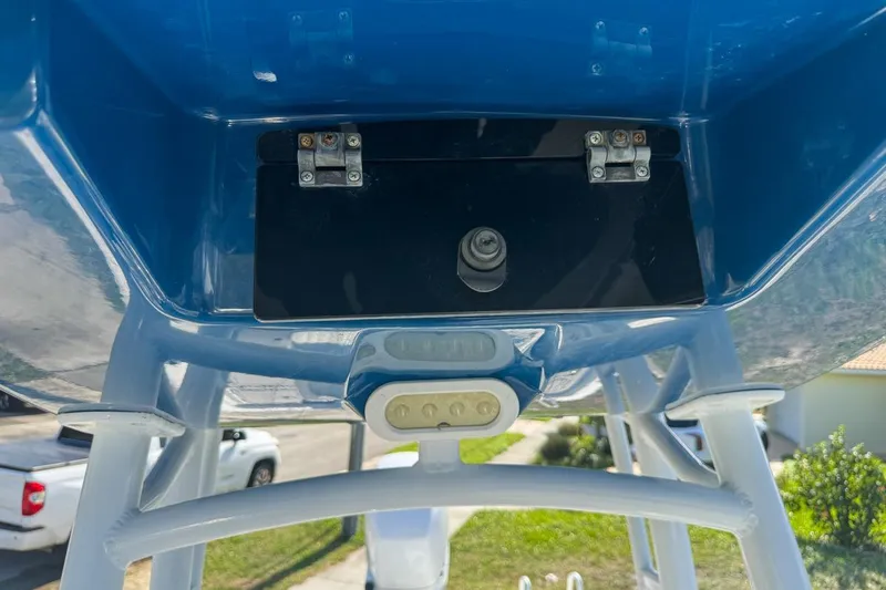 Slide: The Image of 2018 Blue Wave 2400 PureBay boat underside with mounted hardware and blue finish. - 43