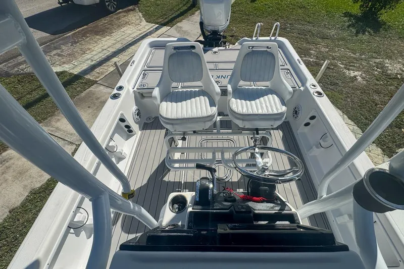 Slide: The Image of 2018 Blue Wave 2400 PureBay boat interior with dual seats and steering wheel. - 48