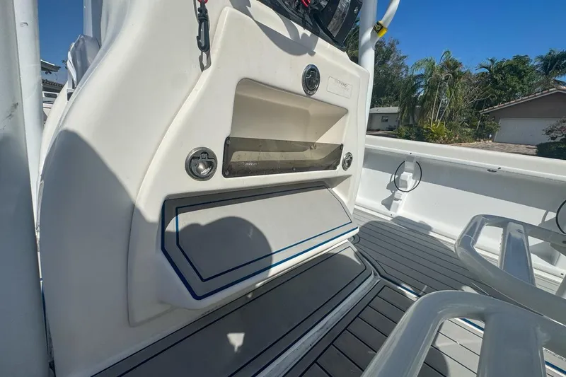 Slide: The Image of 2018 Blue Wave 2400 PureBay boat interior with seating and storage compartments. - 63