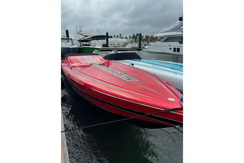 The Image of 2022 Outerlimits SL41 speedboat cruising at sunset on the ocean. - 0