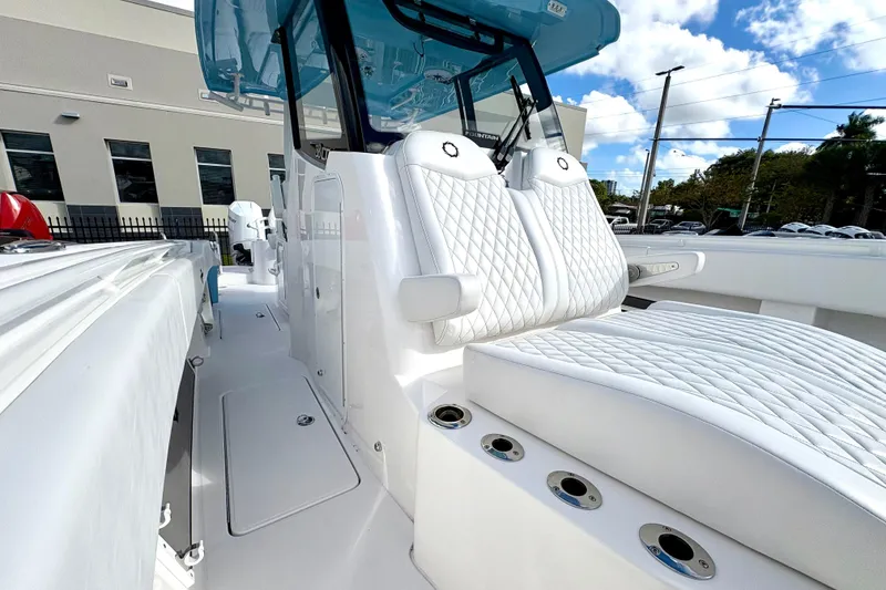 Slide: The Image of 2025 Fountain 38 Center Console boat with luxurious white seating and modern design. - 10