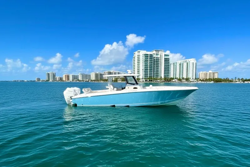 Slide: The Image of 2025 Fountain 38 Center Console boat on blue water with city skyline background. - 17