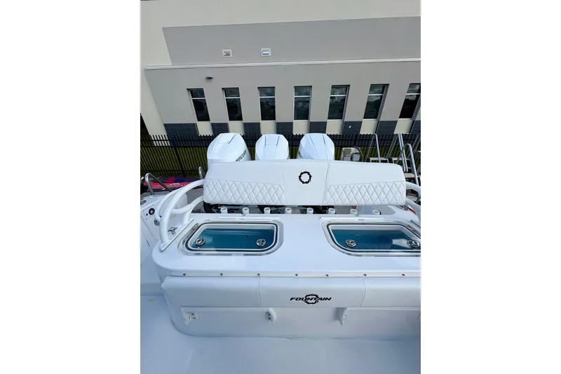 Slide: The Image of 2025 Fountain 38 Center Console boat with triple engines and sleek design. - 3