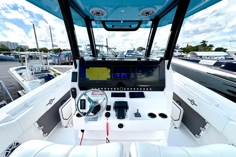 Slide: The Image of 2025 Fountain 38 Center Console boat dashboard with advanced navigation and control systems. - 5
