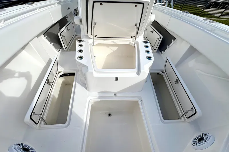 Slide: The Image of 2025 Fountain 38 Center Console boat with open storage compartments and sleek design. - 7