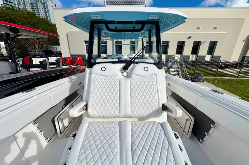 Slide: The Image of 2025 Fountain 38 Center Console boat with luxurious white seating and modern design. - 8
