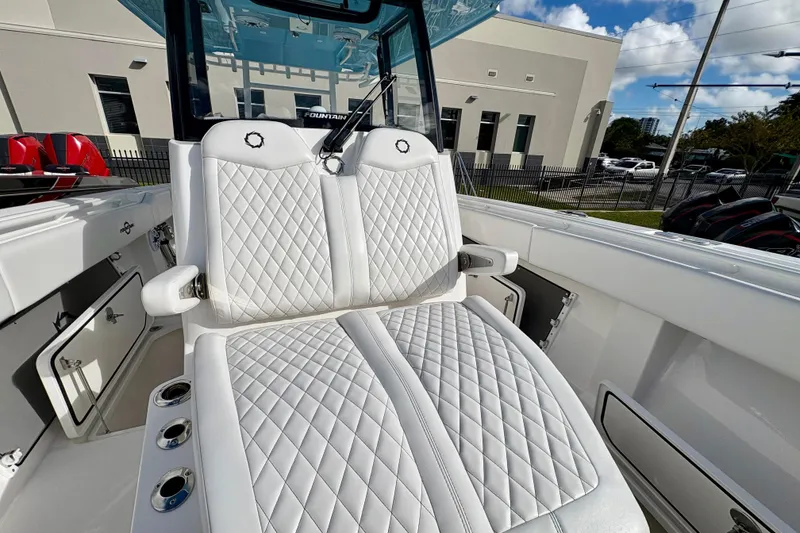 Slide: The Image of Luxurious seating on 2025 Fountain 38 Center Console boat, featuring diamond-stitched upholstery. - 9