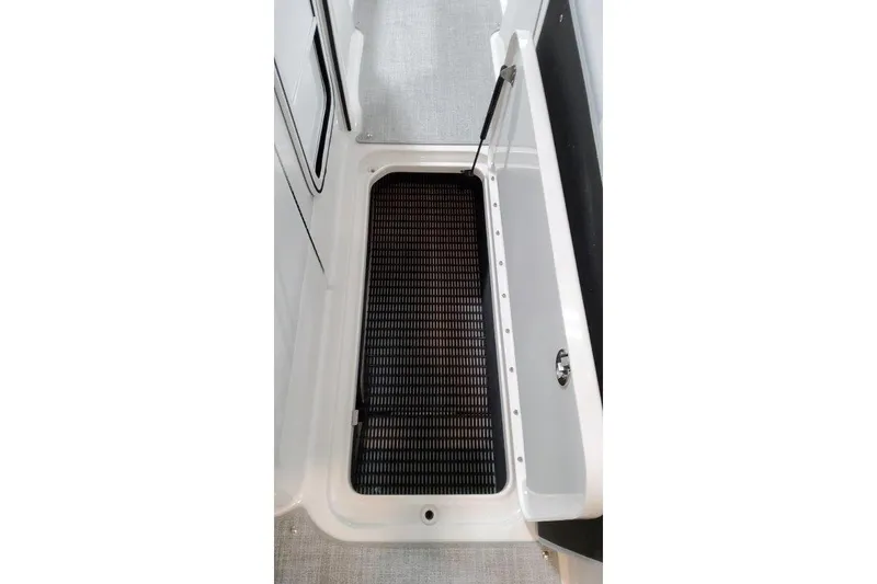Slide: The Image of Interior of 2025 Formula 310 Bowrider I/O with storage compartment. - 15