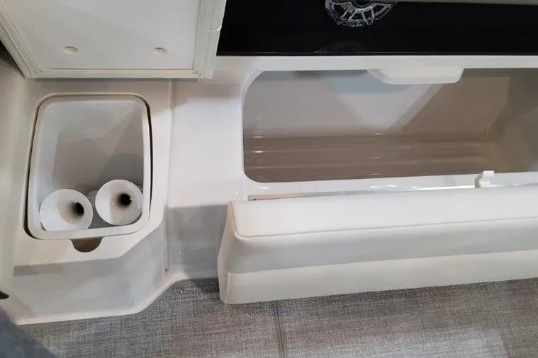 Slide: The Image of Interior of 2025 Formula 310 Bowrider I/O with storage space. - 24