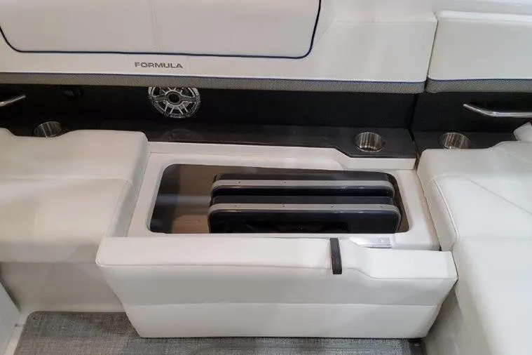 Slide: The Image of Interior of Formula 310 Bowrider I/O 2025 with seating and speaker. - 31