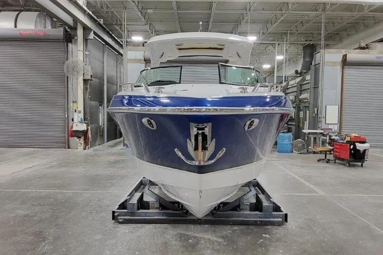 Slide: The Image of 2025 Formula 310 Bowrider I/O in a workshop. - 33