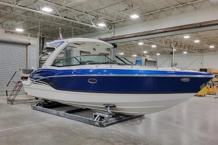 Slide: The Image of 2025 Formula 310 Bowrider I/O boat in a warehouse. - 34