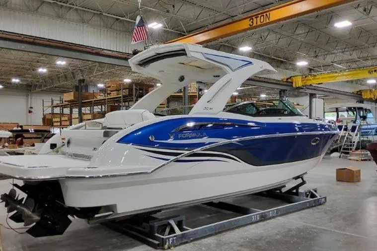 Slide: The Image of 2025 Formula 310 Bowrider I/O boat in a shipyard. - 36