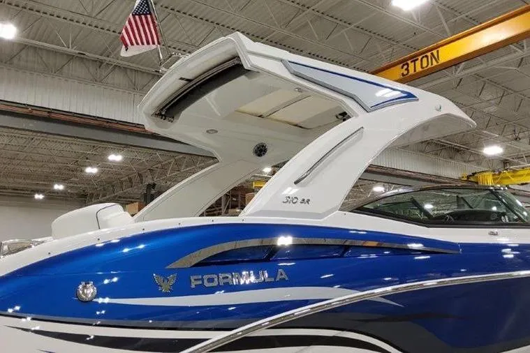 Slide: The Image of 2025 Formula 310 Bowrider I/O boat in a shipyard. - 38