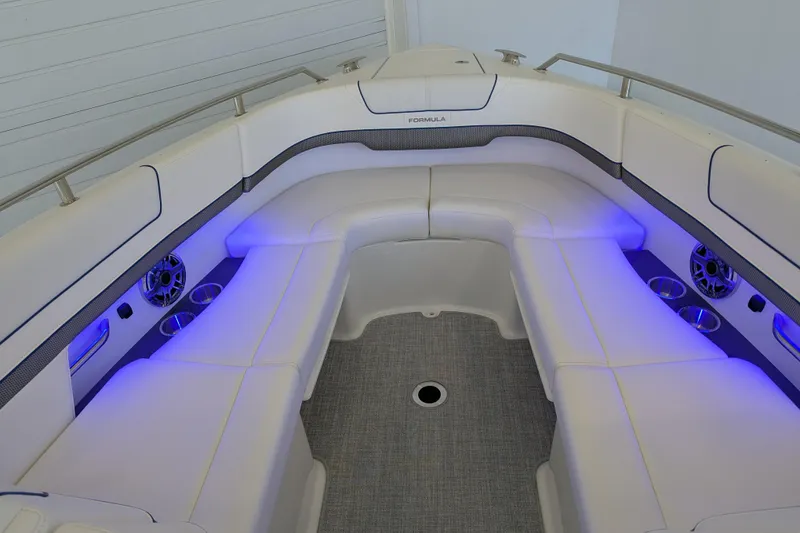 Slide: The Image of Interior of 2025 Formula 310 Bowrider I/O with blue lighting. - 9
