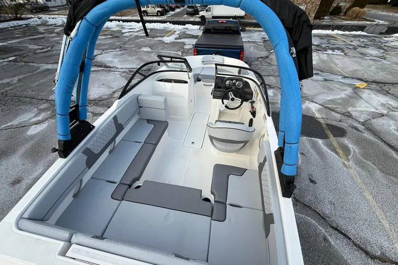 Slide: The Image of 2026 Bayliner VR4 Bowrider OB with spacious seating and modern design in a parking lot. - 4