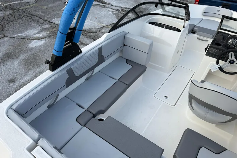 Slide: The Image of 2026 Bayliner VR4 Bowrider OB interior with gray seating and steering wheel. - 5