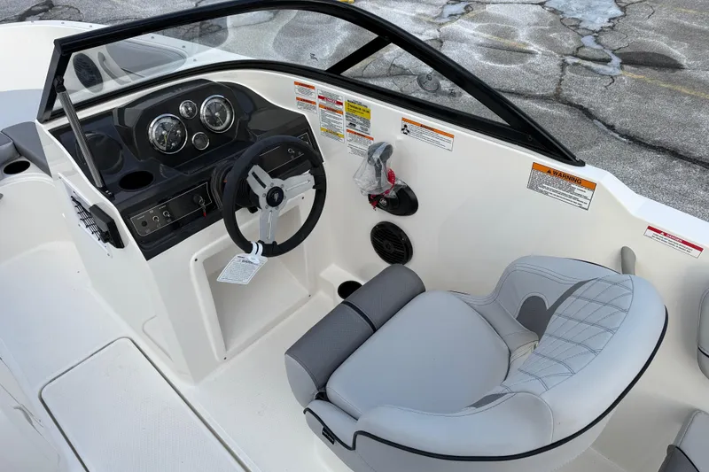 Slide: The Image of 2026 Bayliner VR4 Bowrider OB cockpit with steering wheel and gauges, featuring modern design. - 8