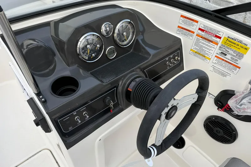 Slide: The Image of 2026 Bayliner VR4 Bowrider OB dashboard with steering wheel and gauges. - 9