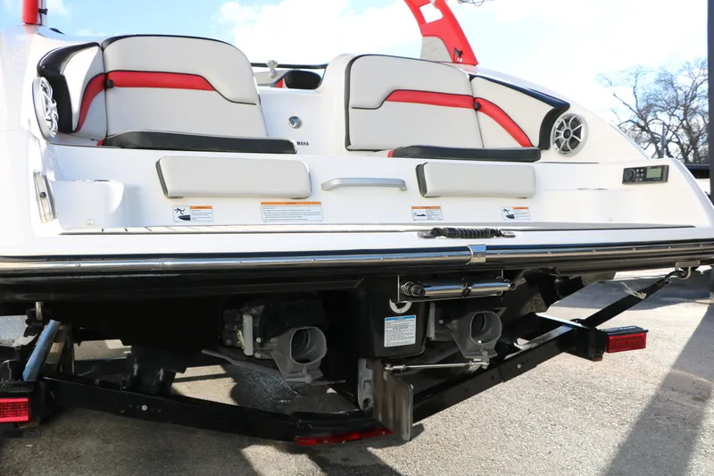 Slide: The Image of 2018 Yamaha Boats 242X E-Series rear view, showcasing seating and jet propulsion system. - 10