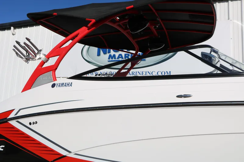 Slide: The Image of 2018 Yamaha Boats 242X E-Series with red accents and wakeboard tower. - 11