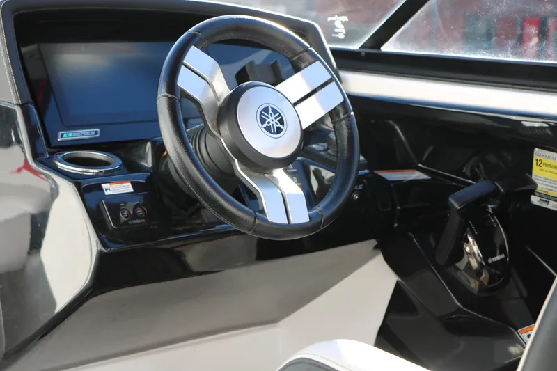 Slide: The Image of 2018 Yamaha Boats 242X E-Series steering wheel and dashboard interior view. - 20