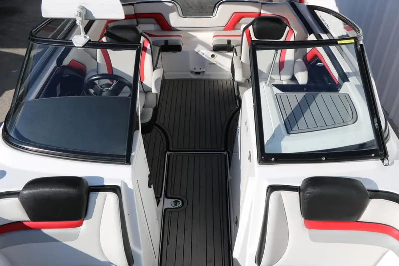 Slide: The Image of 2018 Yamaha Boats 242X E-Series interior with sleek black and red seating. - 25