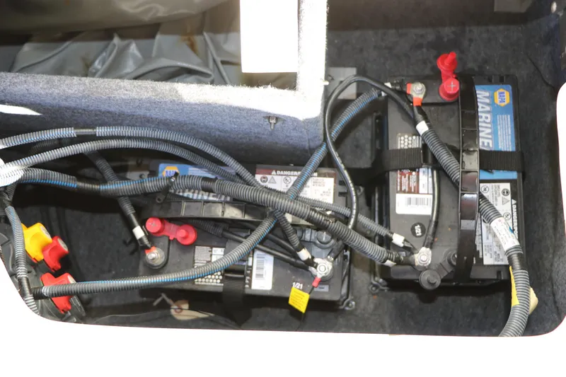 Slide: The Image of 2018 Yamaha Boats 242X E-Series marine battery compartment with wiring. - 31