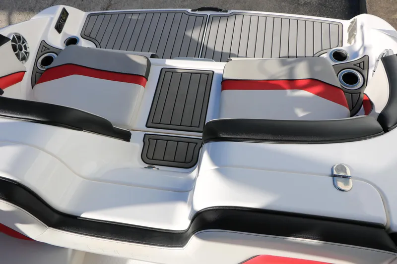 Slide: The Image of 2018 Yamaha Boats 242X E-Series interior with sleek seating and cup holders. - 35