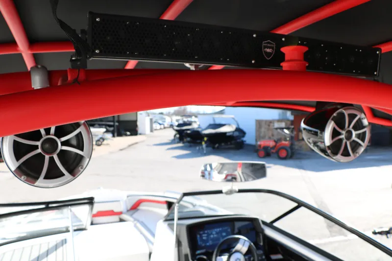 Slide: The Image of 2018 Yamaha Boats 242X E-Series interior with red accents and audio speakers. - 36