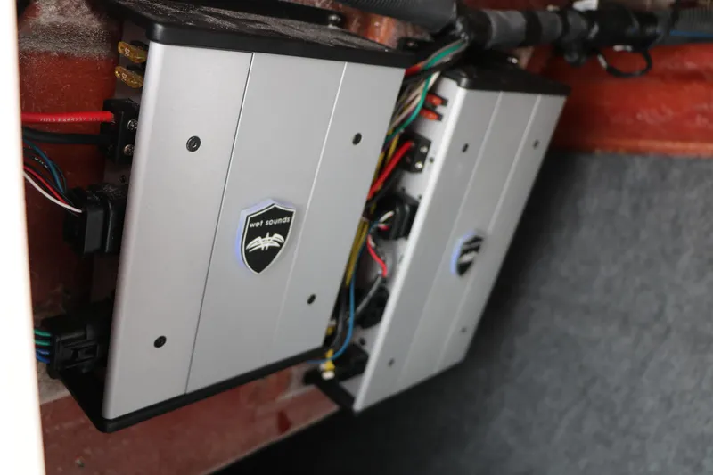 Slide: The Image of Audio system installation in 2018 Yamaha Boats 242X E-Series, featuring Wet Sounds amplifiers. - 38