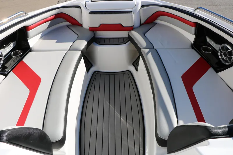 Slide: The Image of 2018 Yamaha Boats 242X E-Series interior with red and gray seating, sleek design. - 39