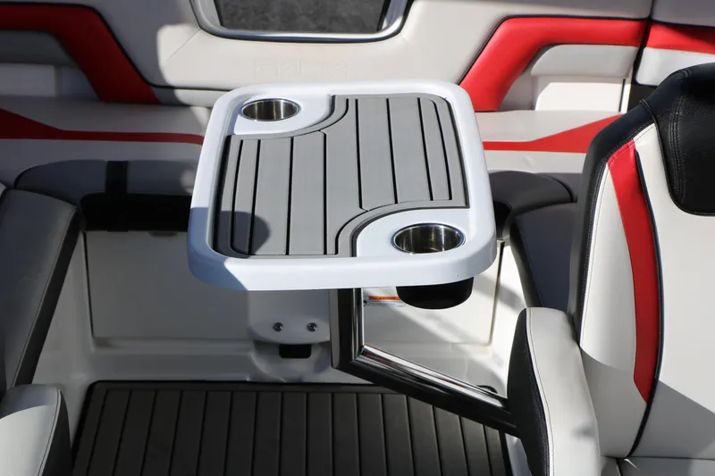 Slide: The Image of 2018 Yamaha Boats 242X E-Series interior with table and cup holders. - 42
